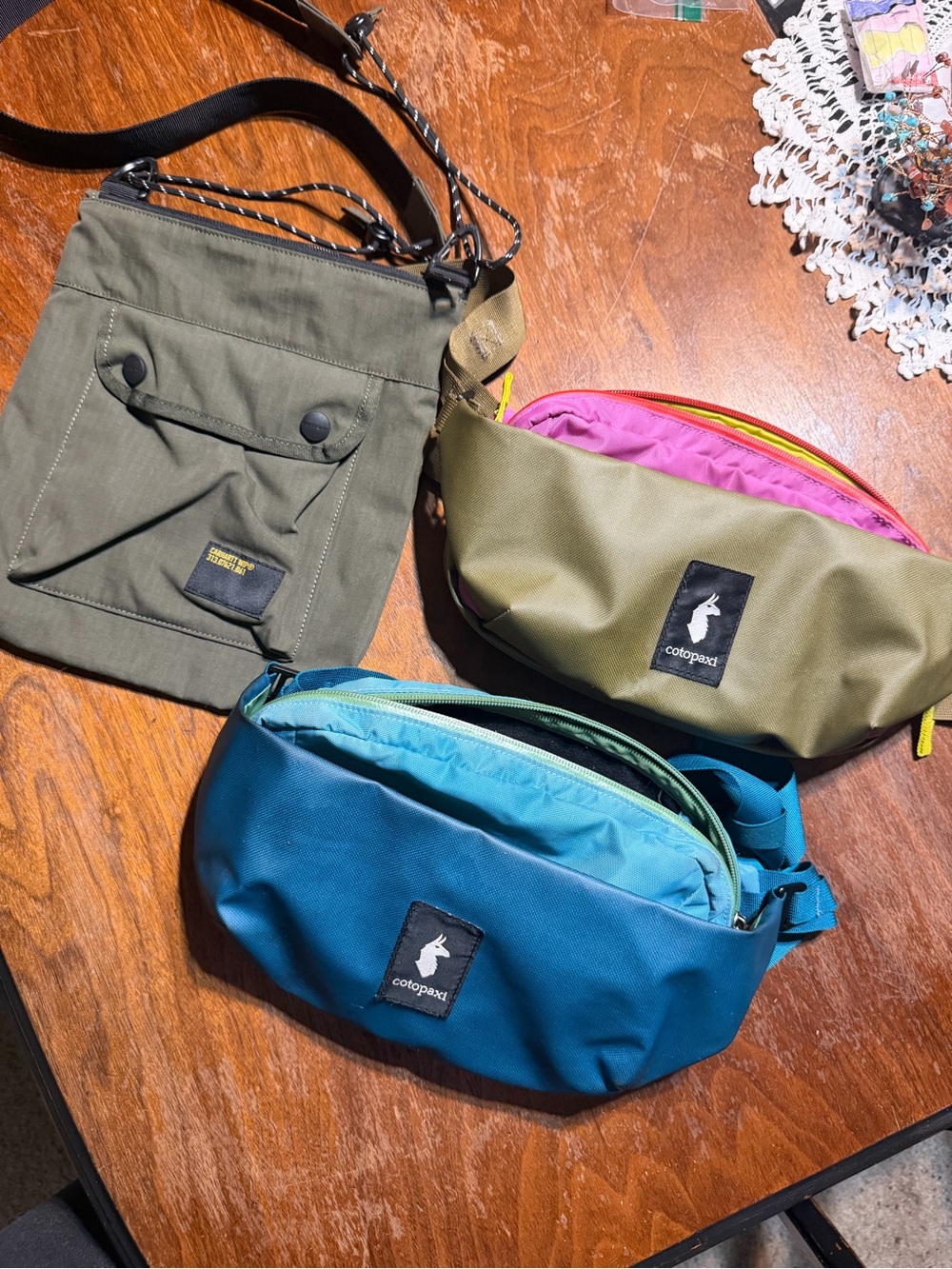 2 Cotopaxi 2L hip pack and carhart wip cross body